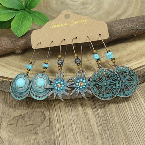 Detailed set of bohemian vintage earrings with turquoise beads and bronze finish