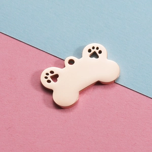 Rose gold stainless steel dog bone pendant with hollow paw prints for DIY pet tags