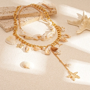 Two-piece gold layered starfish and pearl necklace with beach shell pendants in sea breeze style