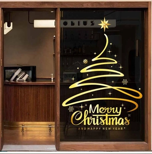 Pegatinas doradas de árbol de Navidad con texto Merry Christmas en escaparate de cristal