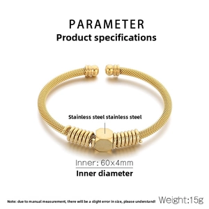 Detail showing 60x4mm inner diameter and weight of gold braided stainless steel bangle