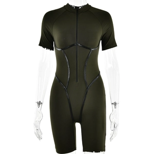 Detail of dark green athletic bodysuit featuring a front zipper and black contrast trim