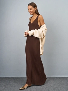 Slim fit dark brown ribbed knit maxi dress layered with a cream cardigan and leopard pumps