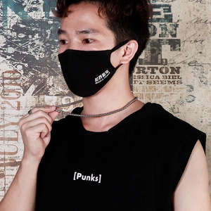 Detail of black fabric face mask with white World Peace text print and streetwear style