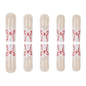 Pink press-on nails with red bow designs and tiny pearls in a long oval shape