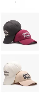 Detailed view of 3D embroidery on baseball caps in grey, burgundy, white and beige