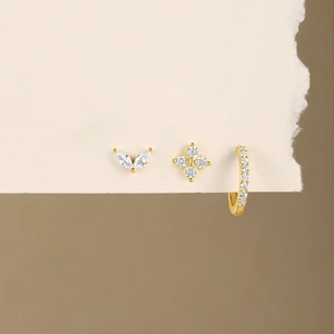 Detailed set of S925 silver leaf stud, floral earring and crystal hoop in gold finish