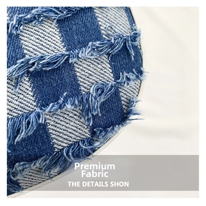 Macro shot of blue denim moon bag fabric texture with fringe edges and plaid pattern