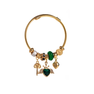 Gold adjustable beaded bracelet with green heart charm and golden crown wings