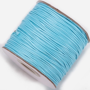 Macro shot of Sky Blue waxed polyester cord roll for DIY jewelry and necklace making