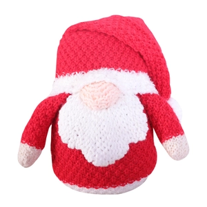 Red and white knitted Christmas gnome ornament with Rudolf nose and bells on white background