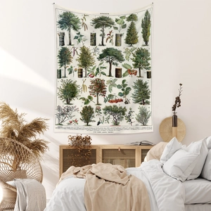 Bedroom scene showing botanical tree tapestry with French text on white wall