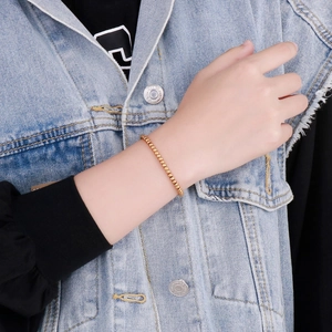 Elegant gold beaded chain bracelet for women featuring 4mm steel beads and lobster clasp