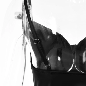Detail view of adjustable spaghetti straps with metal sliders on a black evening gown