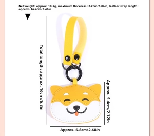 Detailed view of yellow leather dog keychain with black metal ring and size measurements