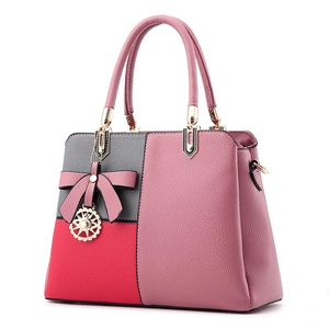 Three-color patchwork leather handbag for women with bow and metallic charm detail