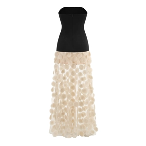 Detail of 3D floral petals and sheer polka dot mesh on back of black strapless dress