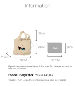 Detailed size view of cream canvas tote bag with dog embroidery and A4 comparison