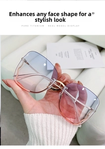 Detail of pure titanium gold temples and rimless gradient blue-pink lenses of sunglasses