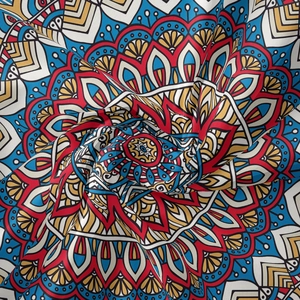 Close-up of bohemian mandala tapestry fabric with intricate colorful patterns and fine texture
