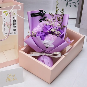 Detailed gift set featuring purple soap roses and carnations in a pink window bag