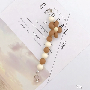 Brown and cream matte beaded lanyard with acrylic flower and silver metal clasps
