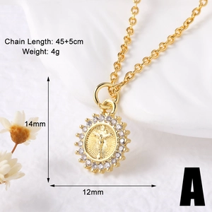 Close-up of gold religious pendant necklace featuring sparkling white crystals in detail