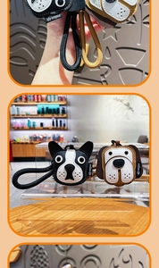 Macro detail of cartoon faux leather puppy charms with woven rope and refined embroidery