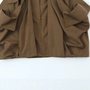 Deep brown cargo skirt made of woven fabric with pocket details and visible stitching