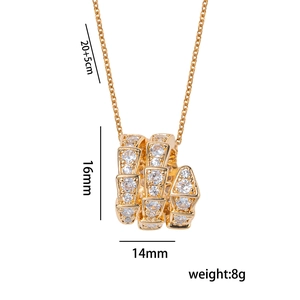 Chic gold snake pendant necklace with white cubic zirconia pavé setting on white background