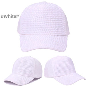 Detailed close-up of a white baseball cap featuring dense faux pearl embellishments