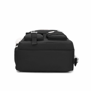 Detail view of large capacity black backpack with double front pockets and side mesh slots