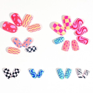 Candy colored almond press-on nails with colorful wave dots and geometric patterns