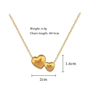Detail of gold double heart necklace showing 40+5cm chain length and 6.9g weight specifications