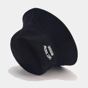 Black canvas bucket hat with white SHITSHOW SUPERVISOR embroidery in a street style