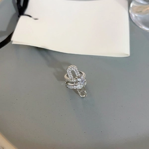 Safety pin style zircon clip earring in silver with sparkling diamond-like stones