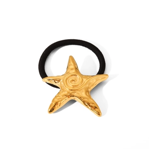 Minimalist 18K gold starfish hair tie with textured metal charm on black elastic band