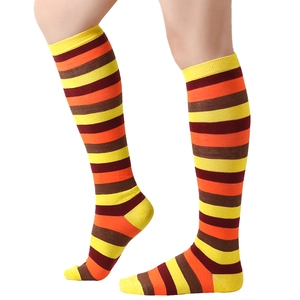 Striped knee-high knit socks with yellow, orange, brown, and deep red horizontal patterns
