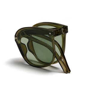 Foldable olive green translucent sunglasses with compact portable design and metal hinges