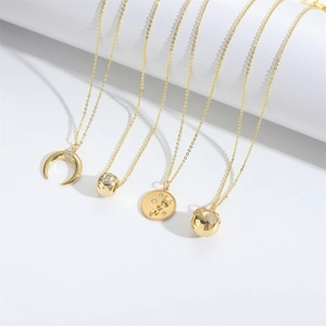 Set of four gold-plated crescent moon and world map necklaces for elegant women