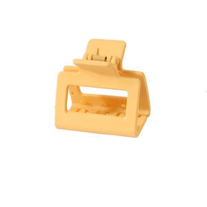 Detailed close-up of a 5cm yellow square matte hair claw clip with internal teeth
