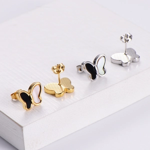 Elegant butterfly shell pendant necklaces in gold and silver finish on white stand