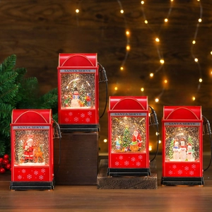 Vintage red Christmas gas pump lantern with festive internal scenes and warm light effect