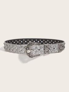 Macro detail of silver rhinestone belt with engraved western buckle and glittery finish