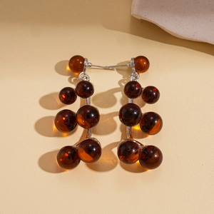 Retro resin geometric round earrings in dark amber finish with silver needle hooks
