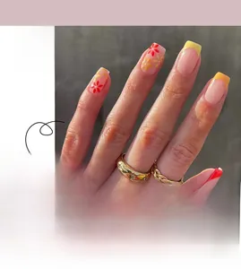 Detail of French floral press-on nails with red and yellow flowers on translucent base