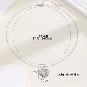 Silver hollow heart necklace with pink gemstone pendant showing size and weight details