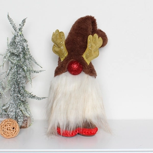 Detail of a Christmas gnome with gold sequin antlers and a fluffy white beard