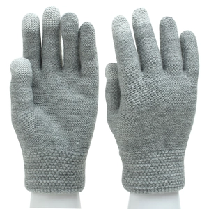 Close-up of gray knitted gloves showing detailed texture and elastic ribbed cuffs