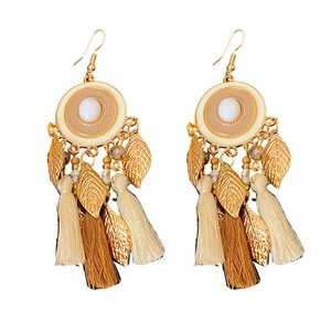 Vintage enamel tassel earrings with bohemian leaf design and beads on white background